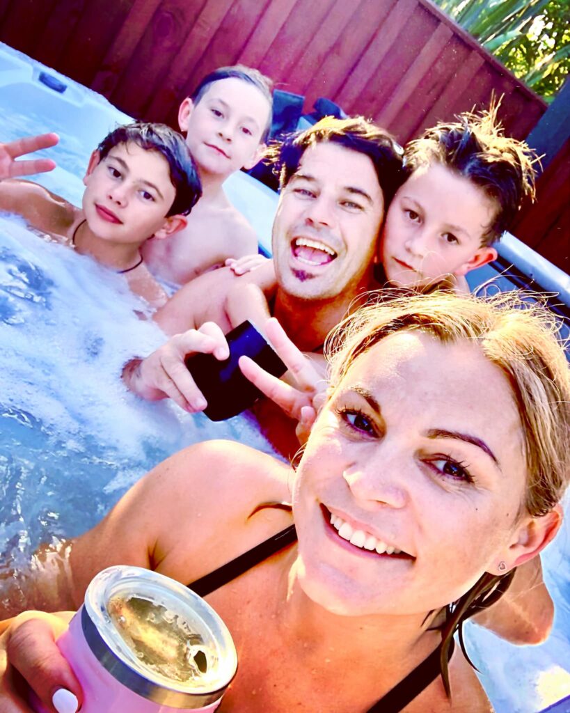 A family enjoying their Thunderbolt spa pool, a quality spa pool that also saves you money