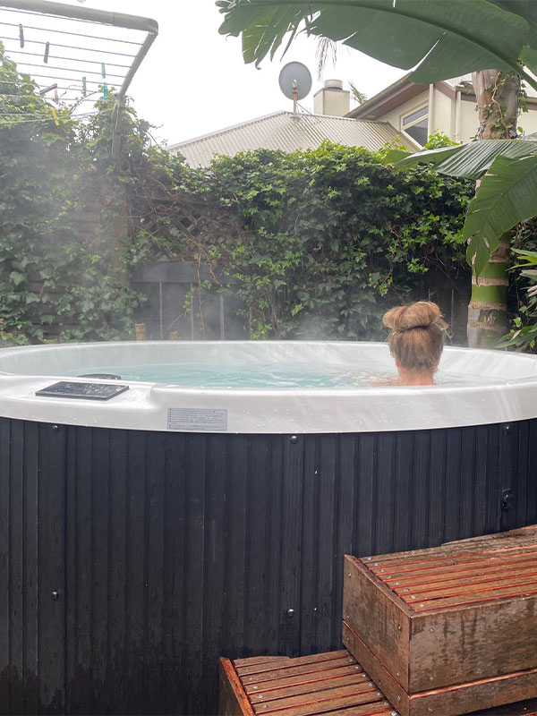 person sitting in a spa pool. Spa Pools Auckland