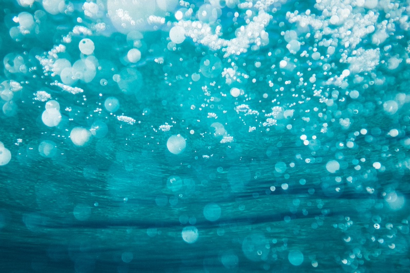 Underwater photo of bubbles rising to the surface