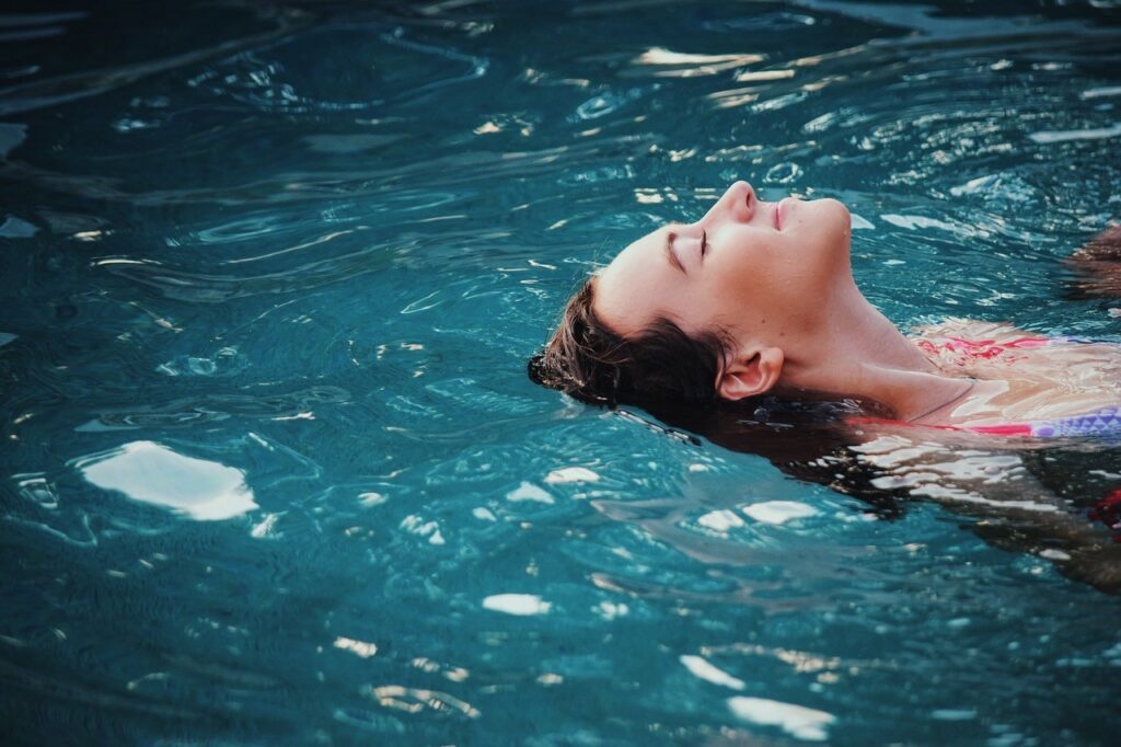 woman lying in water
